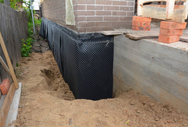 SJ Waterproofing Pros technician performing targeted Emergency Waterproofing assessment in Loretto, PA
